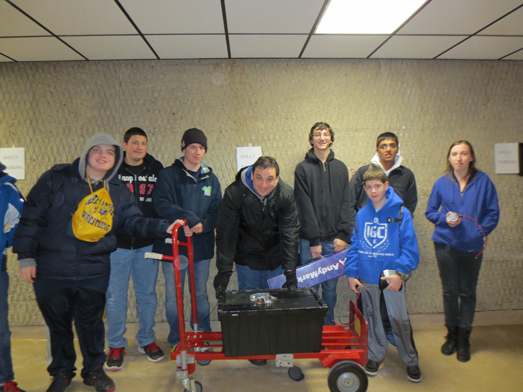 Members of the Bethpage High School robotics team are pictured displaying the contents of the kit of parts.