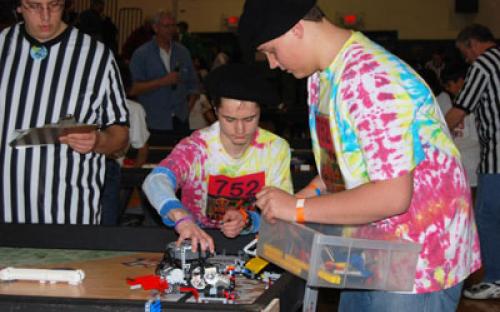 Members of the Bayport “Peaced Together” — Team #752 prepare to program their robot for the course at the March 6 Long Island LEGO League Tournament, “Body Forward.” Five hundred students from 48 teams participated in the event.